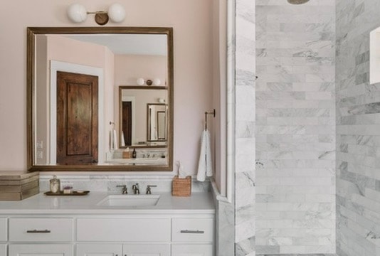Design consulting — marble bathroom with framed mirror