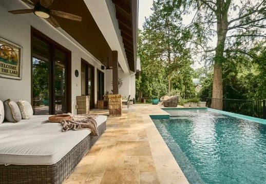 Vacation rental — poolside patio with lounge chairs